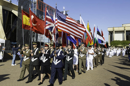 Photo of soldiers carrying the country flags of NATO